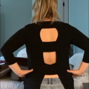 Black tunic top with open back detail